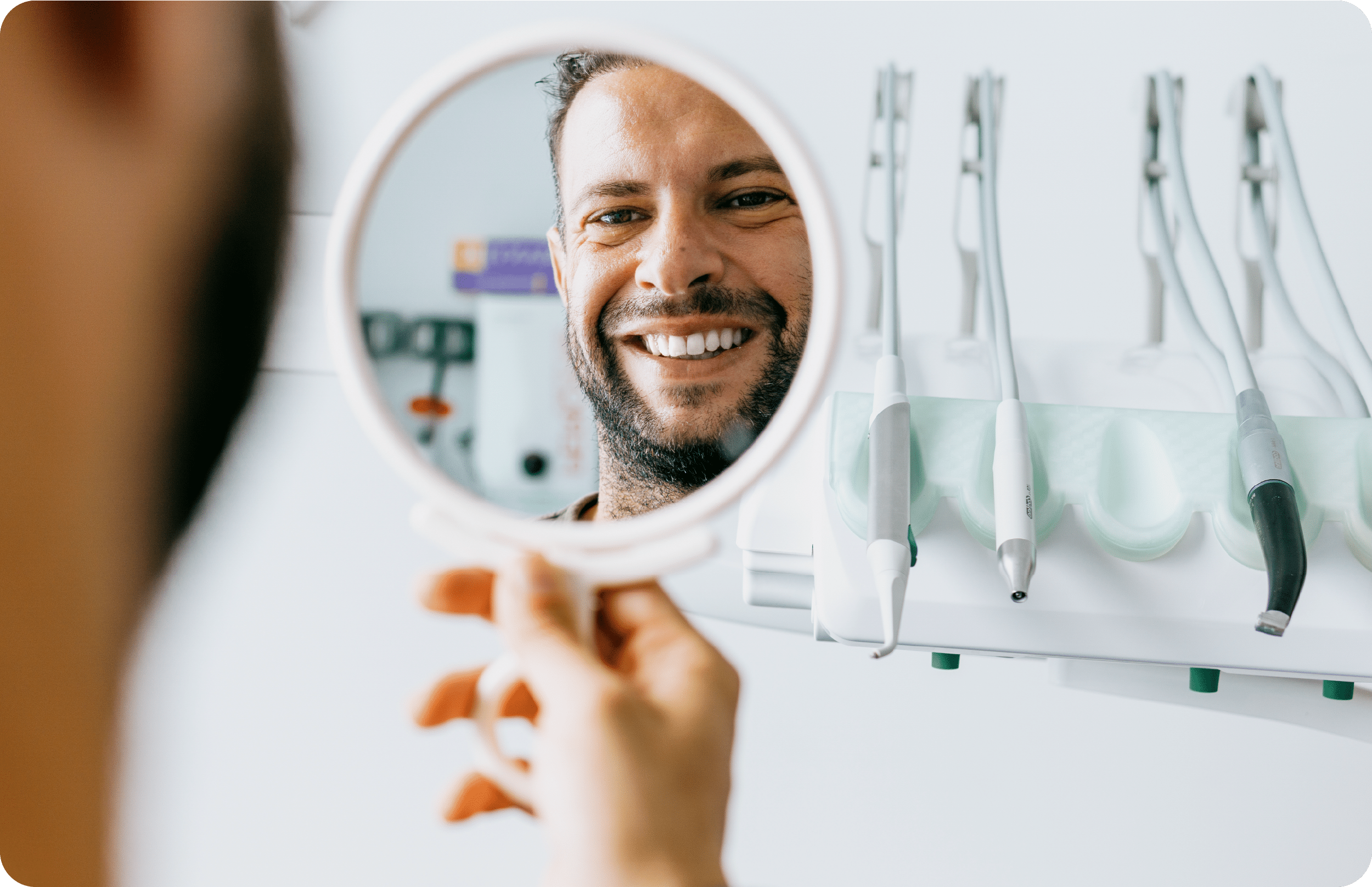 man smiling during a consultation at colorado dental spa