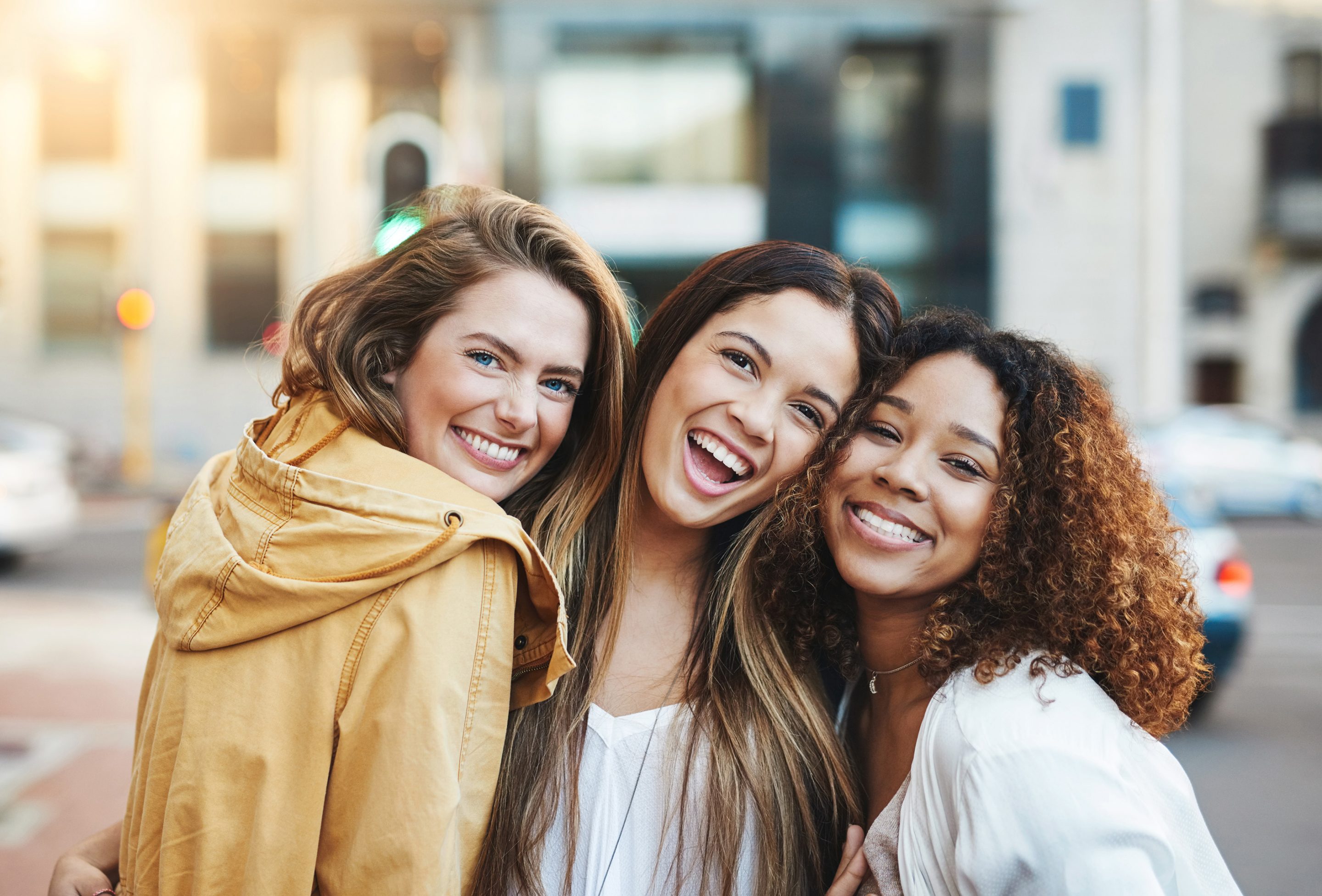 group of girls smiling outside - Colorado Dental Spa