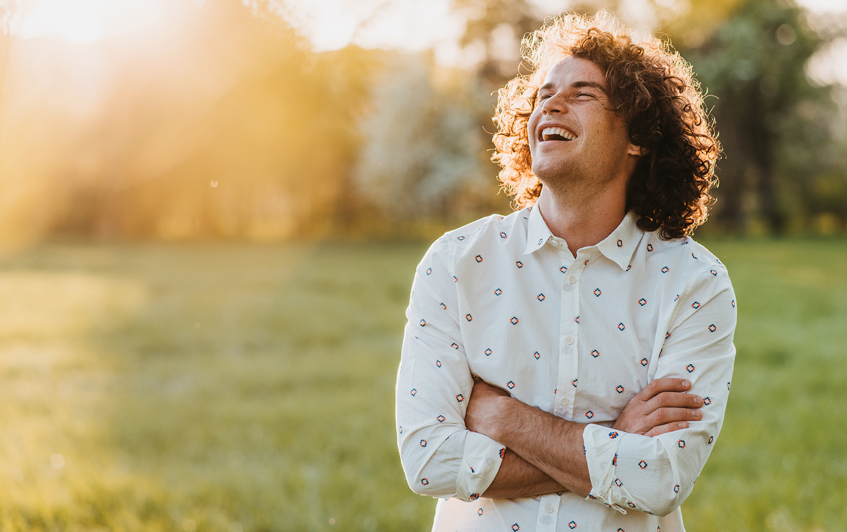 man laughing outside golden, co with clear teeth aligners from coloraod dental spa