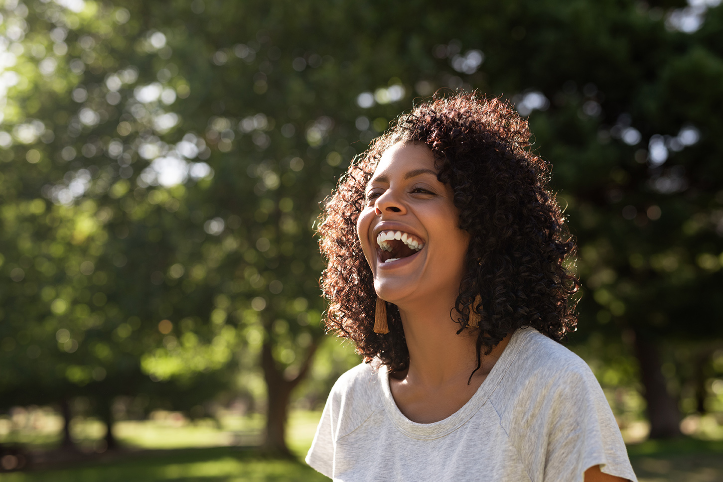 woman enjoying summer after dental implants At Colorado Dental Spa