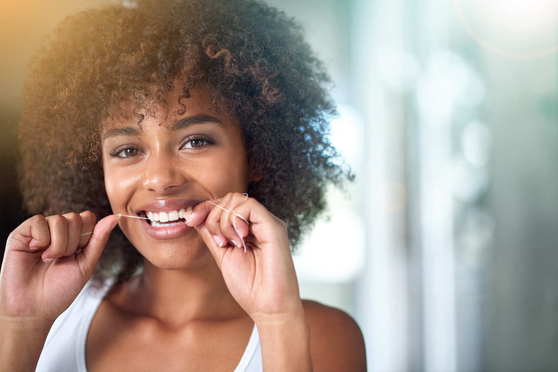 Woman flossing in Golden CO