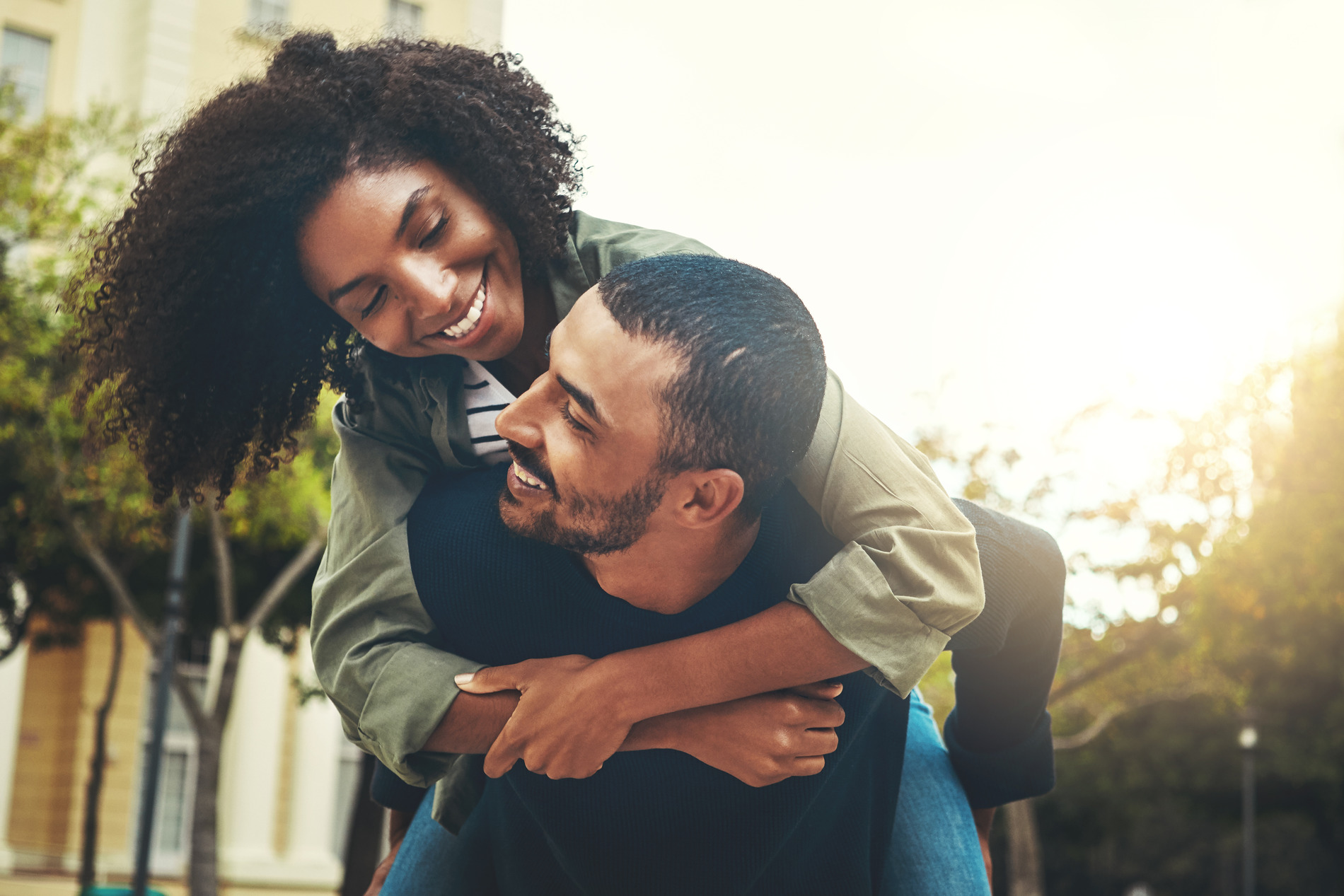 Happy couple hugging after teeth whitening in Golden CO