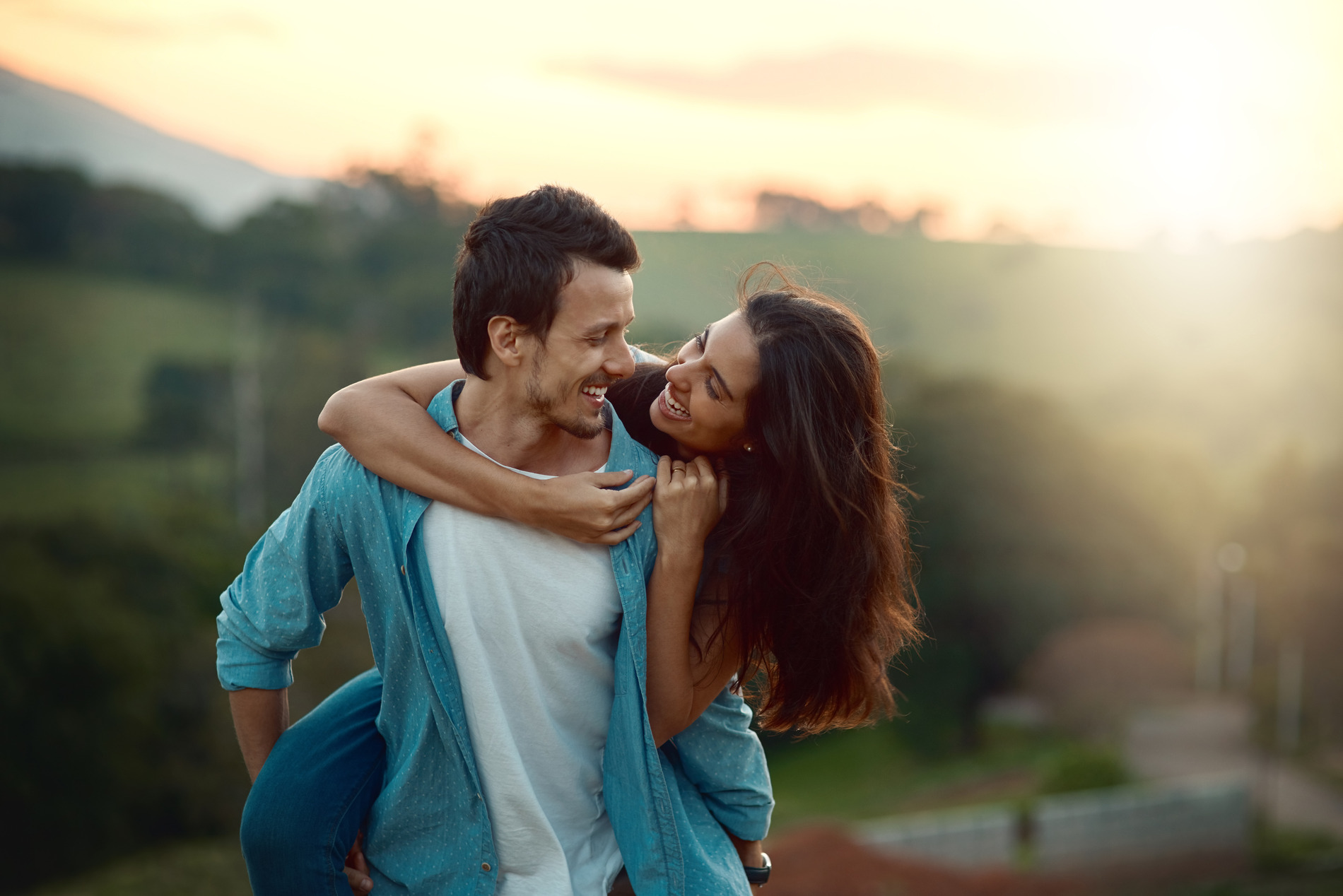 Happy couple smiling after dental crowns in Golden OC